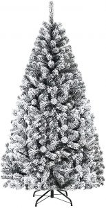 Snow covered artificial christmas tree
